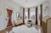 This nice bright room is currently being used as a nursery. Would also make a great study, a 2nd home office or 2nd main level bedroom. Walk in closet. Hardwood flooring. Lovely view to front lawn. There is an access to door to an outdoor patio.