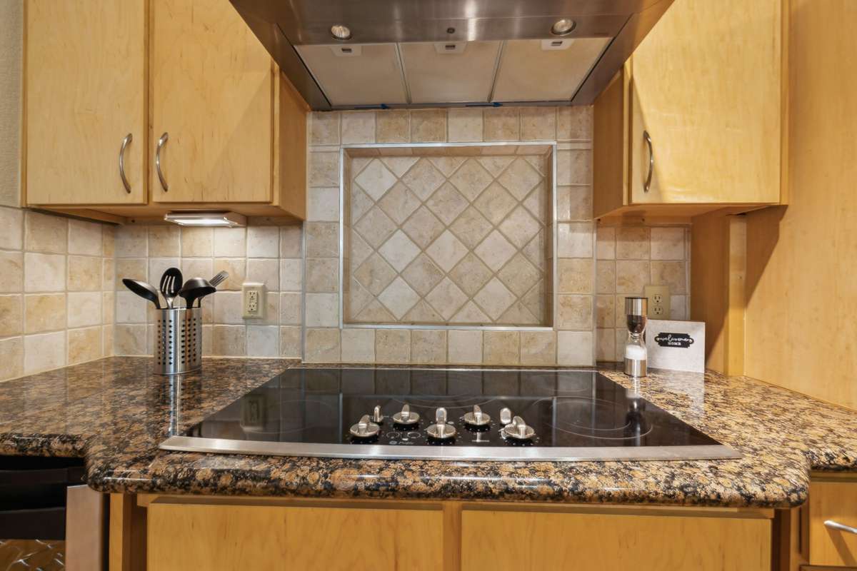 Ceramic cooktop with 5 burners and beautiful stainless hood.