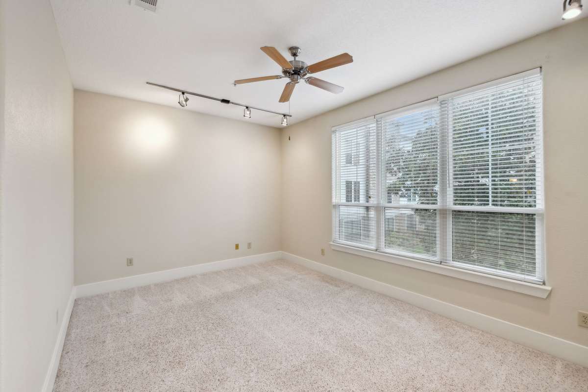 This Living Room gives way to beautiful views of the serene courtyard!