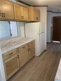 KITCHEN IS NEATLY ARRANGED FOR LESS STEPS