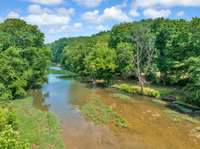 Go camping on your land by the creek!  Kayak. fish and swim.  Leads to the Cumberland River.