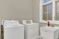 Laundry room just off the kitchen.  Appliances stay
