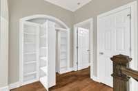 Secret room behind the bookcase.  Lots of storage!