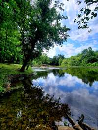 Perfect place to put your kayak in or swim. Before virtual staging.