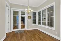 Eat in kitchen with large windows. Before staging.