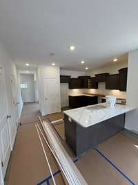 Current status as of 6/23/2025. Kitchen. Will include stainless steel appliances(Fridge, Stove, oven, microwave, and dishwasher).