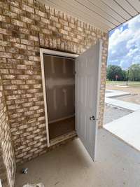 Current status as of 6/23/2025. Patio storage closet. Patio will include vinyl privacy fence.