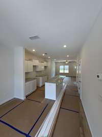 Current status as of 6/23/2025. Kitchen. Will include stainless steel appliances (Refrigerator, stove, oven, microwave and dishwasher.)