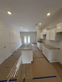 Current status as of 6/23/2025. Kitchen. Will include stainless steel appliances (Refrigerator, stove, oven, microwave and dishwasher.)