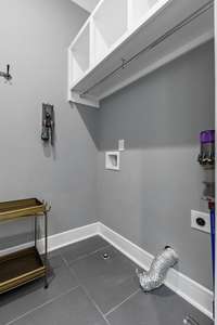 Downstairs laundry off the Primary closet area.