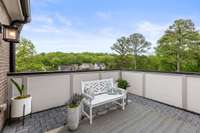 Private deck with custom pavers and privacy wall.