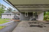 Large carport, nice deck.