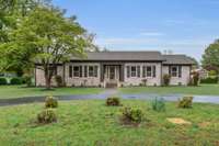All brick 3 bedroom/3 bath home with circular drive!