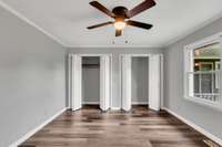 2nd bedroom boasts TWO double closets, great natural light, and new ceiling fan/light fixture.