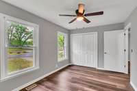 Third  bedroom boasts loads of natural light, double closet, new fan/light fixture.