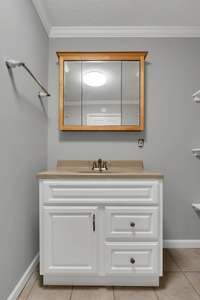 Bathroom 3 houses the water softener/purification system that is owned (not rented) and conveys with the home.
