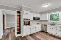 Cookbook nook near the oven and cooktop.