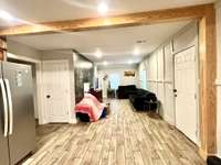 The door to the left is a coat closet and the door to the right goes out the side door.