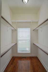 large walk-in closet in bedroom 2 with natural light