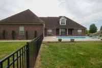 partially fenced back yard for the kids or furbabies.