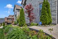 The landscaping and outdoor lighting really make this home pop!