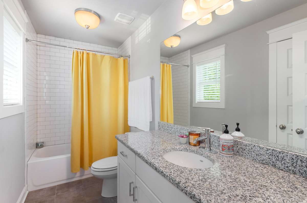 Full bath located off the bonus room, providing an additional bathroom so guests can enjoy the space without needing to go through the second and third bedrooms.