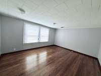 Primary Bedroom with large windows.