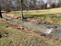 Kids would love playing in this little stream on the 1.5 acre property