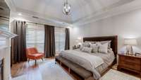 This Primary Bedroom suite is an amazing space that even includes a fireplace