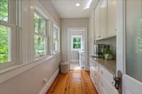 Laundry room with built-in working pantry area stocked with morning coffee!