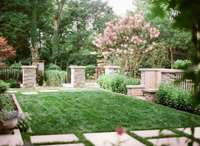 Perfectly manicured side lawn leading to parking area