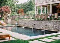 The absolute gem of the backyard is the heated, gunite pool with 3 fountains