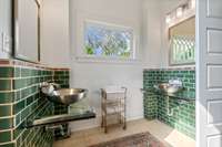 Sunny full bath with rich green tile work