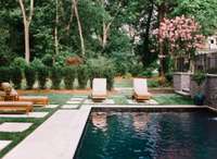 The decking around the pool is Indiana limestone that extends around the pool, the walkways and lawn