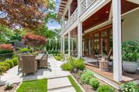 The covered back porch wraps around the home