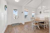 Beautiful spacious dining room with high ceilings.