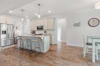 Gorgeous kitchen with granite counter-tops, pantry, eat-in breakfast and soft close drawers.