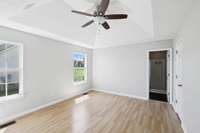 Master Bedroom includes a tray ceiling, ceiling fan...