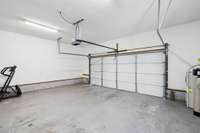 Oversized 2-car garage with opener and room for extra tools and toys.