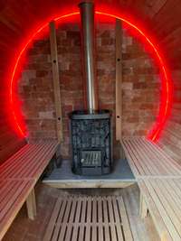The inside of the sauna has a Himalayan salt block wall and traditional rock and wood burning sauna this allows bather to have  steam or sauna with the benefit of the healing affects of the  salt ions released into the room