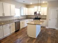 From the foyer you enter the large kitchen with island.
