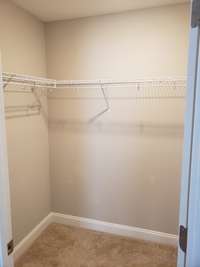 Closet number 1 of the primary bedroom, this closet is accessed directly from the bedroom.