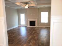 From the dining room to the living room which is at the rear of the home, door goes out to your covered patio and large back yard.