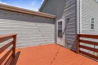 The newly stained deck offers a fresh, polished look.