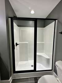 Primary shower with glass doors