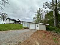 Driveway to the detached garage/workshop directly behind the home.