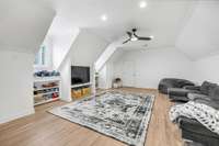 Second floor bonus/play room with built-ins.
