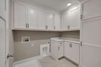 Upstairs laundry room - tons of storage!