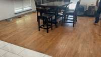 Hardwood Flooring in Dining Area, Living/Great Room, hallways and bedrooms.  Kitchen, Bathrooms and Utility Room have Tile Flooring.
