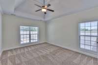 Master bedroom with vaulted ceiling